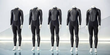 The best triathlon wetsuits for beginners displayed on five mannequins.