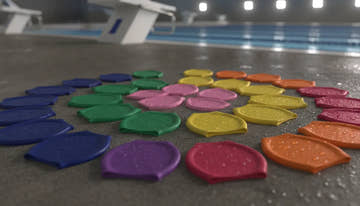 Various colorful swim caps silicone and latex arranged neatly on a wet poolside