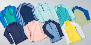 Colorful long-sleeve kids rash guards in a variety of styles.
