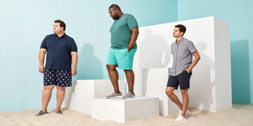 A group of men wearing comfortable and stylish plus size swimwear at the beach.