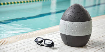 A Speedo pull buoy on a pool deck for building upper body strength.