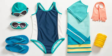 Essential kids swimming gear including a swimsuit, goggles, swim cap, and training fins.